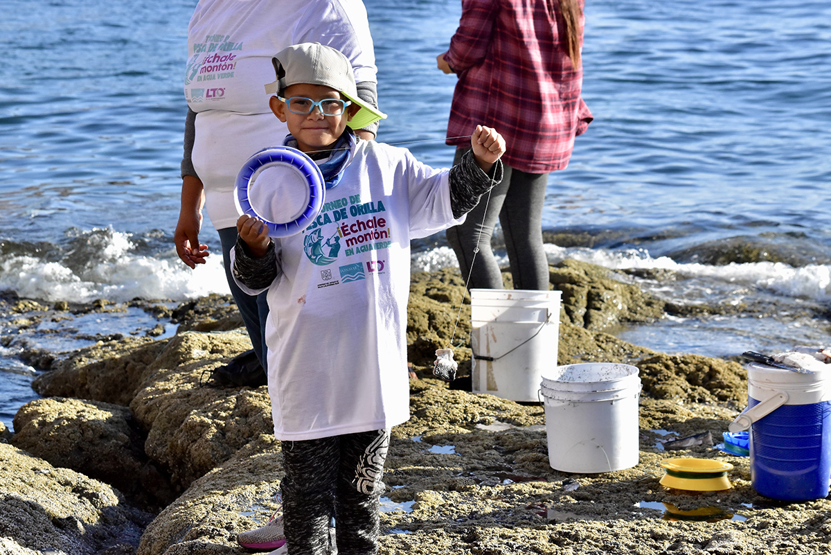 Young boy preparing to fish with his handline